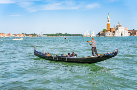 Venice, Italy - May 30 2023: Traditional gondola ride on the Grand Canal.Tourists in Venice.のeditorial素材