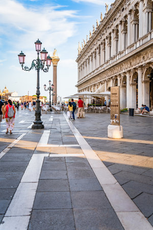 Venice, Italy - May 30 2023: Many tourists visiting Piazzetta San Marco (St Marks Square) and Colonna di San Marco in Venice.のeditorial素材