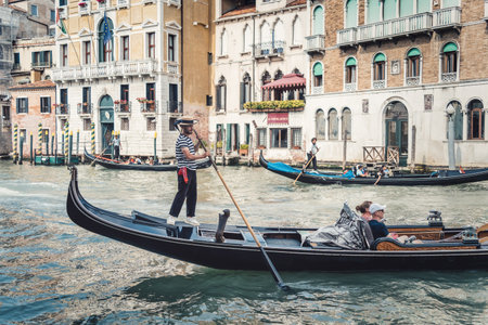 Venice, Italy - May 30 2023: Traditional gondola ride on the Grand Canal.Tourists in Venice.のeditorial素材