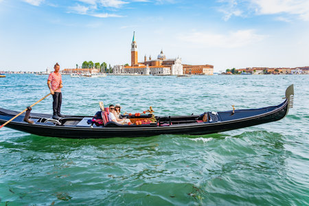 Venice, Italy - May 30 2023: Traditional gondola ride on the Grand Canal.Tourists in Venice.のeditorial素材