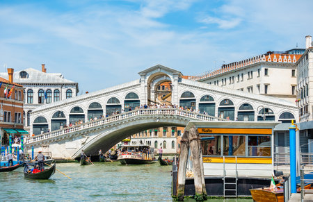 Venice, Italy - May 30 2023: The famous Rialto bridge and the vaporetto public transport station stop in Venice.のeditorial素材