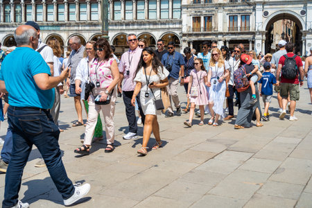 Venice, Italy - May 31 2023: Organized group of tourists in Piazza San Marco, Venice.のeditorial素材