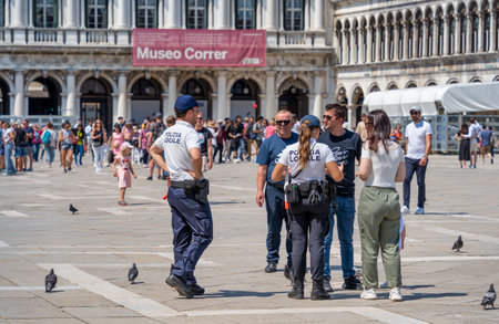 Venice, Italy - May 31 2023: Local police - Plizia Locale in San Marco Square (St Marks Square) in Venice.のeditorial素材
