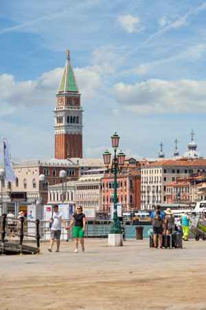 Venice, Italy - May 31 2023: Crowds of tourists strolling on the cobblestone alley near Grand Canal in Venice.のeditorial素材