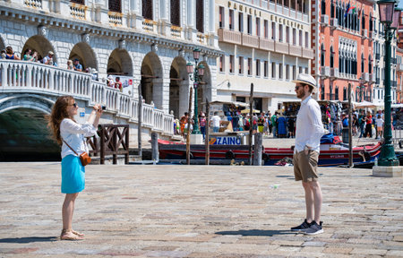 Venice, Italy - May 31 2023: Crowds of tourists strolling on the cobblestone alley near Grand Canal in Venice.のeditorial素材