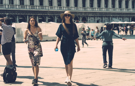 Venice, Italy - May 31 2023: Young tourist girls visiting St. Mark s Square in Venice.のeditorial素材