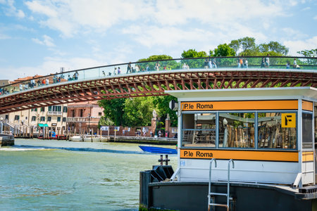 Venice, Italy - May 31 2023: Tourists walking on Constitution Bridge (Ponte della Costituzione) in Venice and the Piazzale Roma vaporetto station.のeditorial素材
