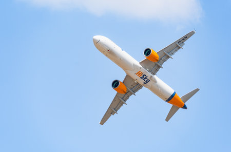 Bucharest, Romania - 25 September 2023: HiSky Airways Airbus A321-271NX flying against blue sky. Airplane takes off from Henry Coanda International Airport.のeditorial素材