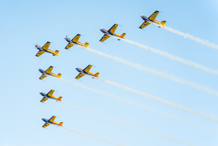 Bucharest, Romania - August 25 2023: Extra 330SC german aerobatic monoplanes flying in formationのeditorial素材