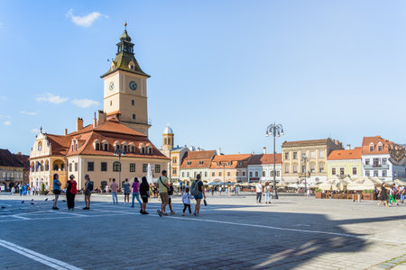 Brasov, Romania - September 02 2023: Brasov city hall clock tower located in the old town Council Square.のeditorial素材