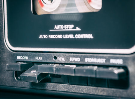Close up with a audio tape in a retro music player.の写真素材