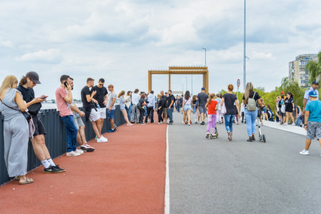 Bucharest, Romania - September 16 2023: Crowds of people and families strolling on a weekend on the promenade of Dambovita lake ( Lacul Morii) in Bucharest.のeditorial素材