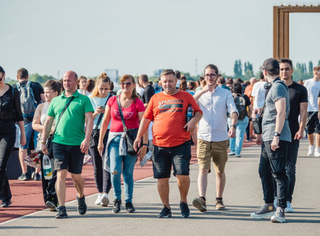 Bucharest, Romania - September 16 2023: Crowds of people and families strolling on a weekend on the...