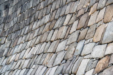 Traditional japanese stone wall moat at the base of Osaka Castle. Texture background.