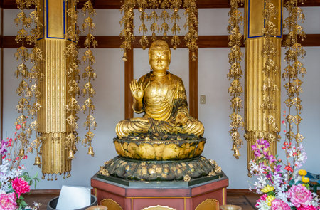 Golden statue of Buddha at Fushimi Inari Taisha, in Kyoto Japan.の写真素材