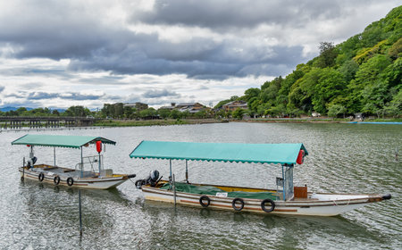 Scenic landscape from Arashiyama with japanese boats at the dock on Katsura river, in Kyoto.の写真素材