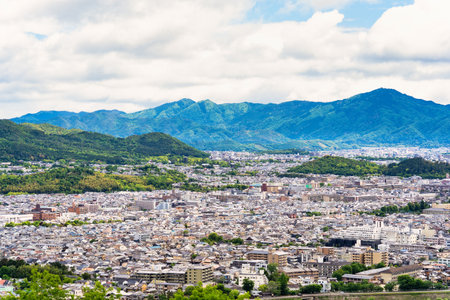 Scenic aerial view with the city of Kyoto from Iwata Mount Summit Rest Area, in Arashiyamaの写真素材
