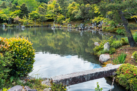 Beautiful scenic Japanese garden with a large pond. Sogenchi Garden on the grounds of Tenryu-ji Temple located in Arashiyama, Kyoto.の写真素材