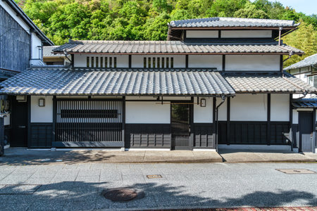 Medieval traditional Japanese architecture. Facade of a house with wooden doors in Arashiyama district of Kyoto, Japan.の写真素材