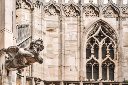 Architectural gothic detail of the iconic Milan Cathedral or Duomo di Milano, the main attraction in the city of Milan.の写真素材