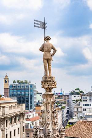View from the rooftop of the Milan Cathedral (Duomo di Milano), one of the most famous Gothic cathedrals in the world, overlooking the city of Milan, Italyの写真素材