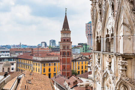 View from top of Duomo di Milano with the Bell tower of the catholic church of San Gottardo in Corte at the Royal Palaceの写真素材