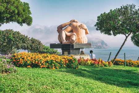 Idyllic scene from Parque del Amor with the iconic El Beso sculpture overlooking the Pacific Ocean.の写真素材