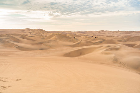Ica desert landscape with smooth golden sand dunes near Huacachina, Peru.