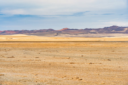 A breathtaking view of the arid desert terrain in Paracas National Reserve, Peru.の写真素材