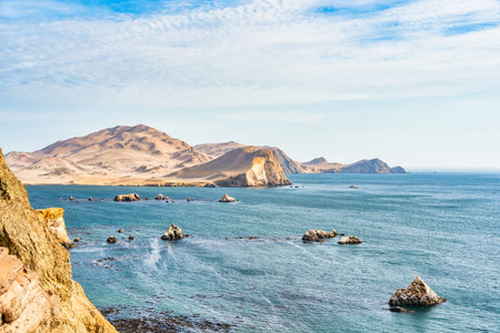 Dramatic landscape with the rocky coastline of the Pacific ocean in Paracas National Reserve, Peru.の写真素材