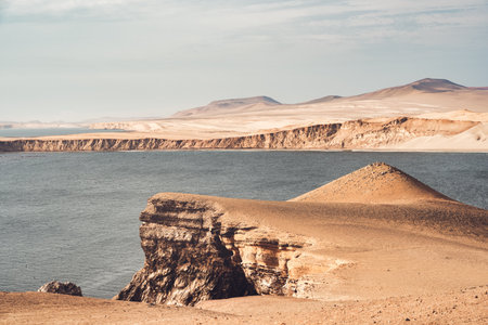 Dramatic landscape with the rocky coastline of the Pacific ocean in Paracas National Reserve, Peru.の写真素材