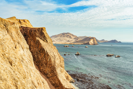 Dramatic landscape with the rocky coastline of the Pacific ocean in Paracas National Reserve, Peru.の写真素材