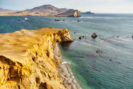 Dramatic landscape with the rocky coastline of the Pacific ocean in Paracas National Reserve, Peru.の写真素材