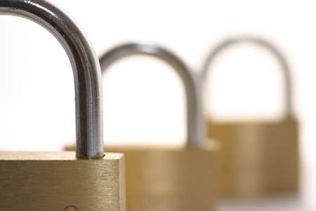 three locks with focus on the first oneの写真素材