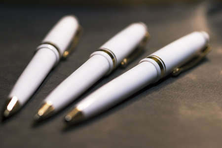 pens on black background with selective focusの写真素材