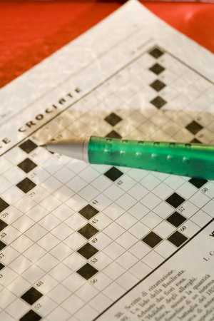 cross words magazine on red background with golden raysの写真素材