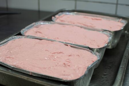 Meatloaf in trays fresh pulled out from the ovenの写真素材