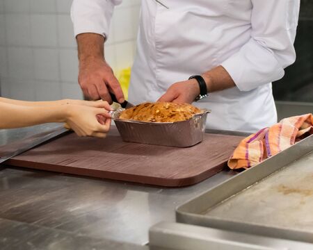 Meatloaf in trays fresh pulled out from the ovenの写真素材