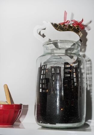 Angel Christmas decoration with bottle of wine and flower decorations. Festive specific table ornamentの写真素材