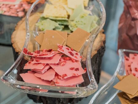 Thin slices, small pieces of colored artisan homemade chocolate snaps bites chipsの写真素材
