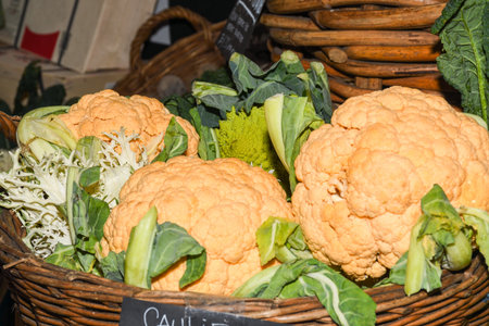 Assortment of fresh salads and vegetables at the market.