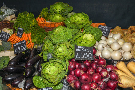 Assortment of fresh salads and vegetables at the market: sweetheart cabbage, savoy, cauliflower
