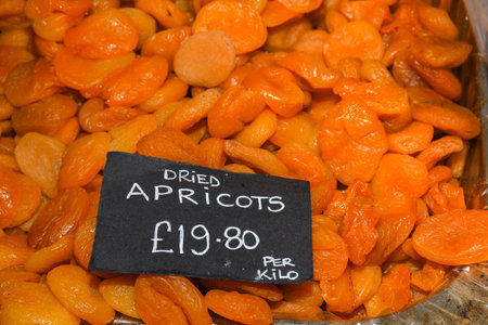 Dried apricots background, tropical fruits preservation in markets for gift and souvenirs