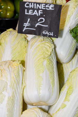 Local produce for sale displayed at the market. Borough farmer's market in London. Organic and bio fresh healthy eating concept. Veggies, vegetables, herbs and spicesの写真素材