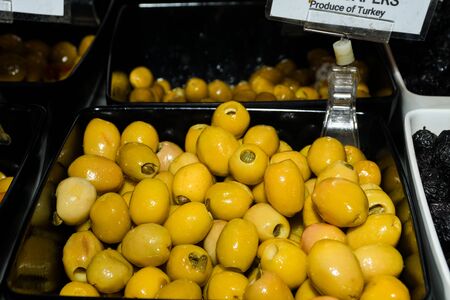 Turkish olives different mix for sale in Grand Bazaar, Egyptian outdoor market. Fresh produce in marketplace, Greek varieties also.の写真素材