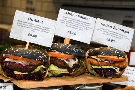 Fresh melting burger ready to eat during fast food festival. Outdoor catering event, brunch or...