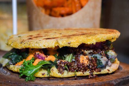 Street food displayed during food festival. Mexican, Indian, Asian, British specialties. Fresh Food Buffet Brunch Catering Dining Eating Party Sharing Conceptの写真素材