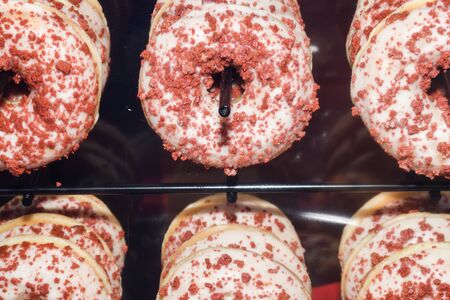 Close up donuts for sale in bakery shop at supermarket.Delicious breakfast dessert for coffee break at the morning time.の写真素材