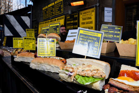 Street food displayed during food festival. Mexican, Indian, Asian, British specialties. Fresh Food Buffet Brunch Catering Dining Eating Party Sharing Conceptのeditorial素材