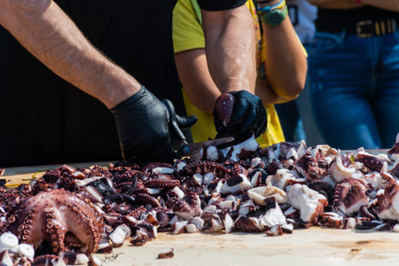 Octopus small chopped bites, street food festival. Seafood festival. Live cooking session contest....